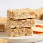 Delicious and healthy 3 ingredient apple oatmeal bars on a wooden plate