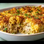 Creamy tuna noodle casserole topped with breadcrumbs and fresh parsley