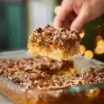 Delicious slice of old-fashioned Cajun cake topped with cream and colorful sprinkles