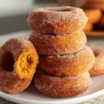 Delicious homemade pumpkin donuts topped with glaze and spices