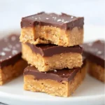 4 ingredient no bake healthier peanut butter bars on a plate