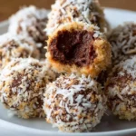 Delicious Chocolate Coconut Cookie Truffles displayed on a plate.
