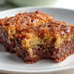 Delicious German Chocolate Dump Cake served with chocolate and coconut topping