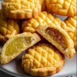 Pineapple-shaped tart cookies with a golden crust and vibrant filling