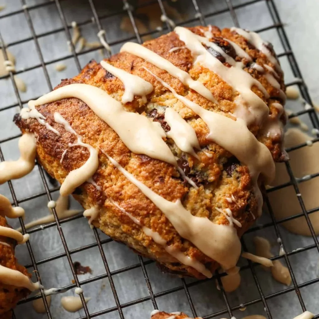 Freshly baked chocolate chip banana scones on a wooden table