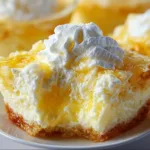 Delicious Lemon Fluff dessert served in a bowl with lemon slices