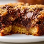 Peanut Butter Cup Dump Cake topped with chocolate and peanut butter frosting