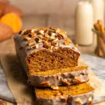Slice of vegan sweet potato bread on a wooden cutting board