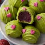 Festively decorated Grinch Oreo Truffles, perfect for holiday treats