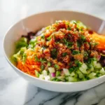 Ground turkey lettuce wrap bowls with fresh vegetables and sauce
