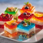 Colorful jello shots served alongside cake and salad at a vibrant party