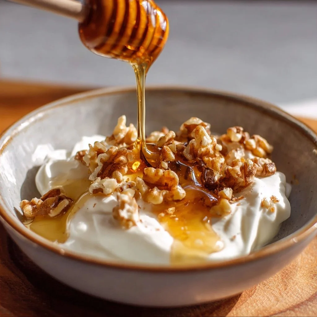 A cup of Manuka honey herbal tea with herbs and honey for balanced blood sugar.