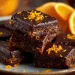 Festive New Year Chocolate Orange Squares with chocolate drizzle and orange zest