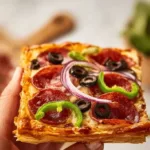 Delicious puff pastry pizza topped with fresh ingredients