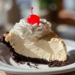 Delicious Root Beer Float Pie topped with whipped cream and root beer flavor
