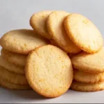 Plate of freshly baked basic butter cookies with a golden brown color