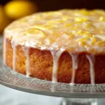 Delicious slice of lemon cake with icing on a white plate