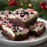 Delicious Peppermint Holiday Bars displayed on a festive plate.