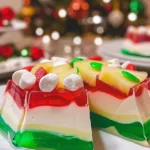Colorful Christmas Ribbon Salad with layers of fresh vegetables