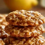No-bake lemon oat cookies on a plate with lemon slices and oats