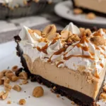 No bake peanut butter pie topped with whipped cream and chocolate