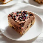 Delicious chocolate chip cookie cake topped with chocolate chips.