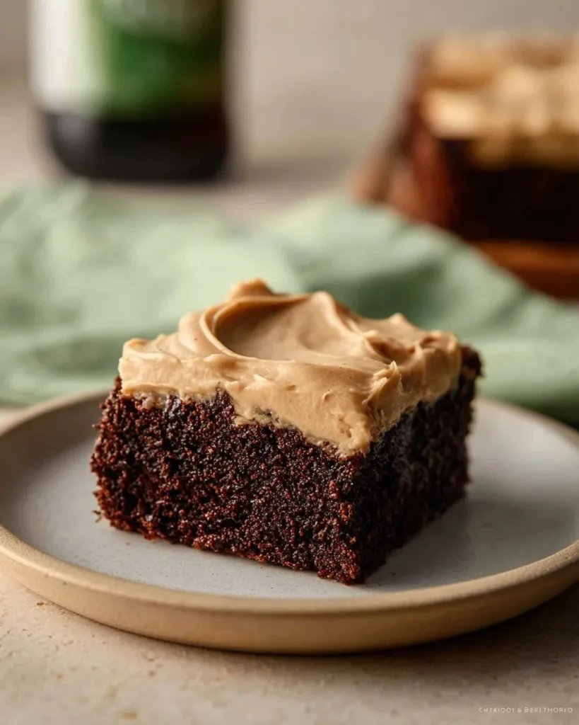 Delicious Guinness brownies with creamy Guinness frosting on a white plate
