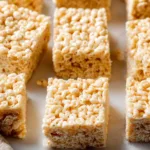 Delicious homemade Rice Krispie Treats made with marshmallows and crispy cereal.