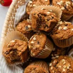 Freshly baked applesauce muffins cooling on a wire rack