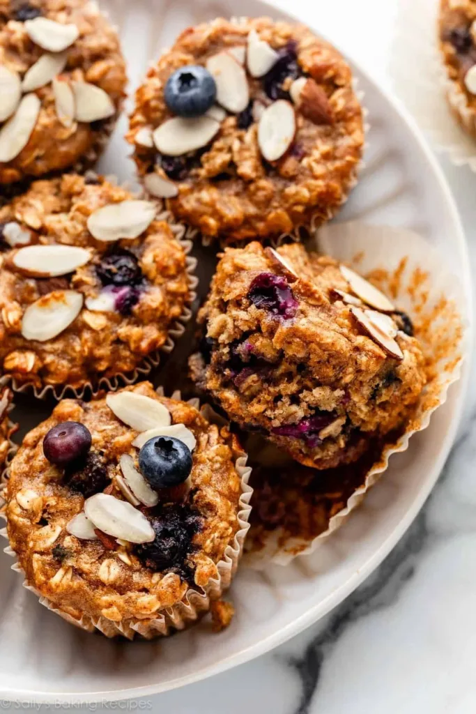 Freshly baked Blueberry Almond Power Muffins on a wooden table