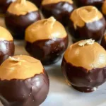 Delicious Buckeyes peanut butter balls coated in chocolate.