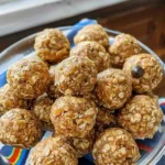 Delicious homemade peanut butter balls on a wooden table
